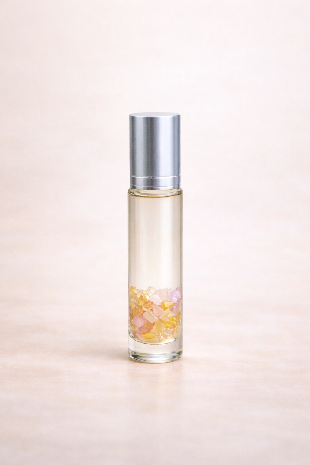 10ml clear glass roller bottle with silver cap representing the blend aurora, to support irritabile feelings & encourage optimism 