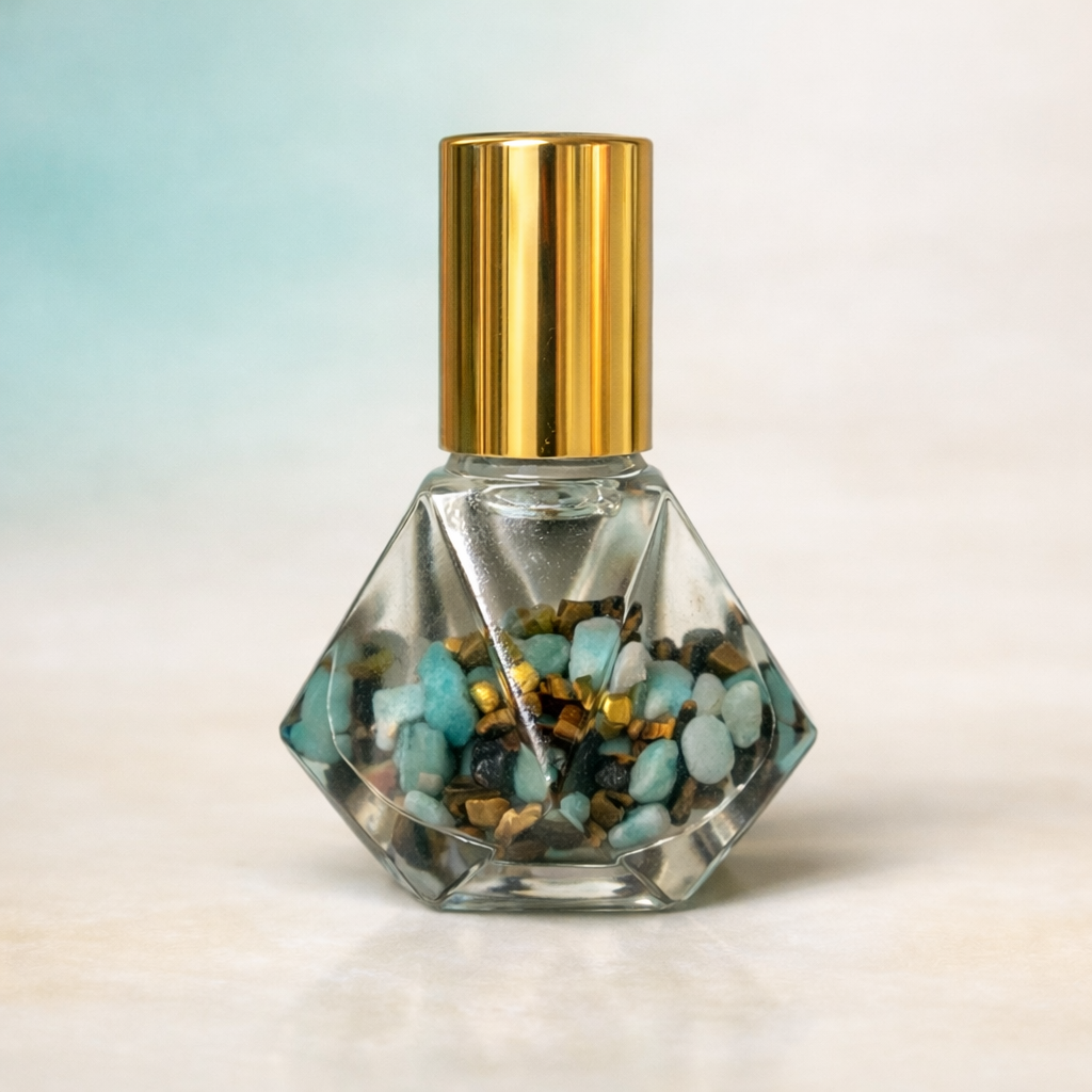 5ml clear diamond cut glass rollerbottle with gold cap & stainless steel rollerball amazonite & tigers eye crystals infused with the blend lucid for clarity & focus inside roller bottle 