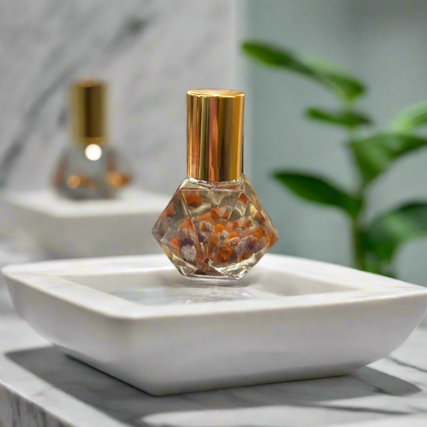 diamond roller bottle placed on white glass square dish ontop of marble bathroom counter 